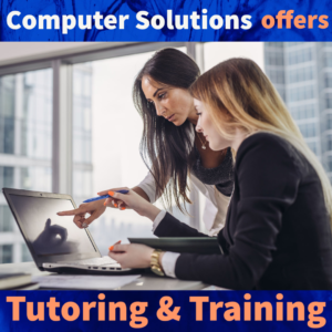 Text- computer Solutions offers tutoring & training

Image- a woman pointing at her screen, while another woman instructs her 