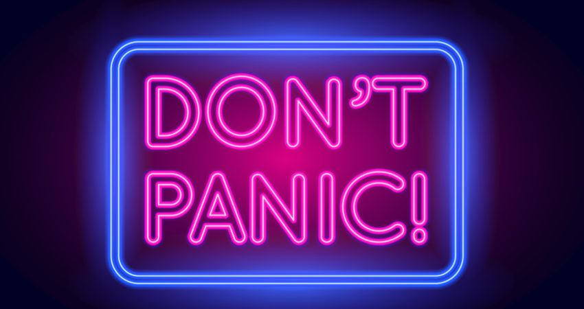 Neon sign saying don't panic