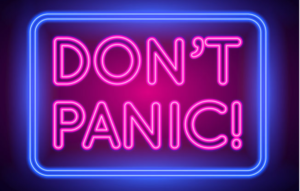 Text: Don't Panic

Image : neon pink sign with neon blue boarder